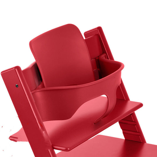 Red high chair with baby seat on a white background