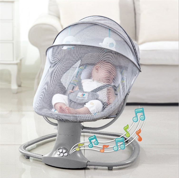 Baby in a gray baby swing with musical notes on a light background