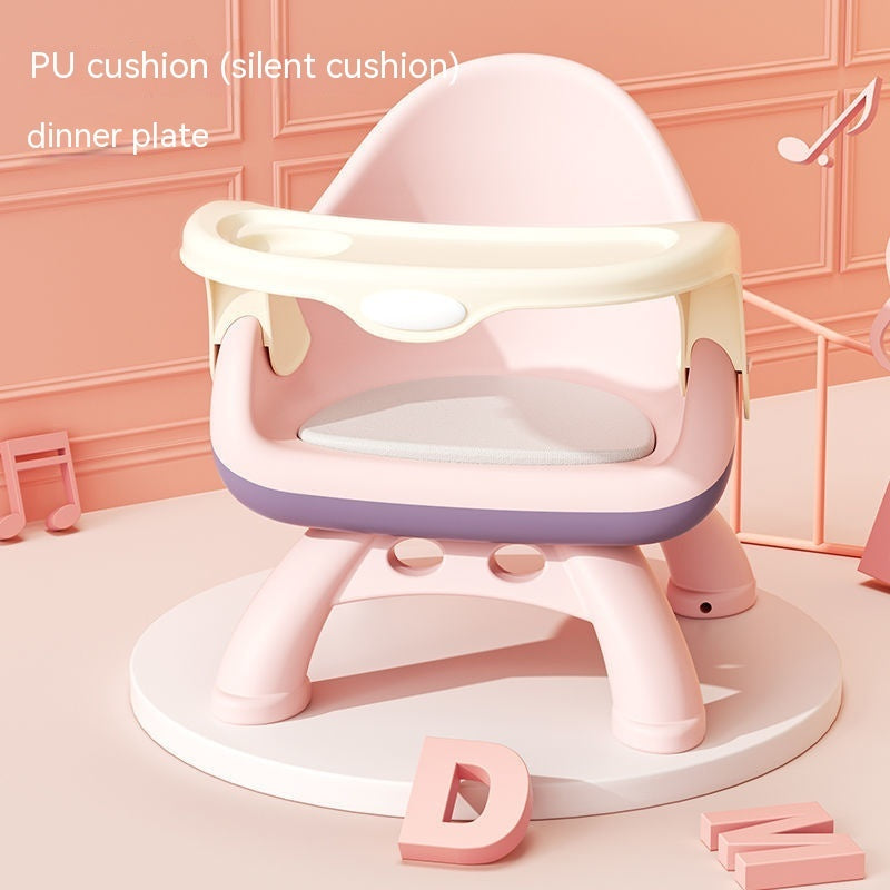 Pink and white baby chair with cushion on a pink background