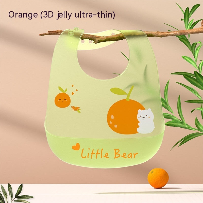 Green bib with orange design and 'Little Bear' text on a beige background
