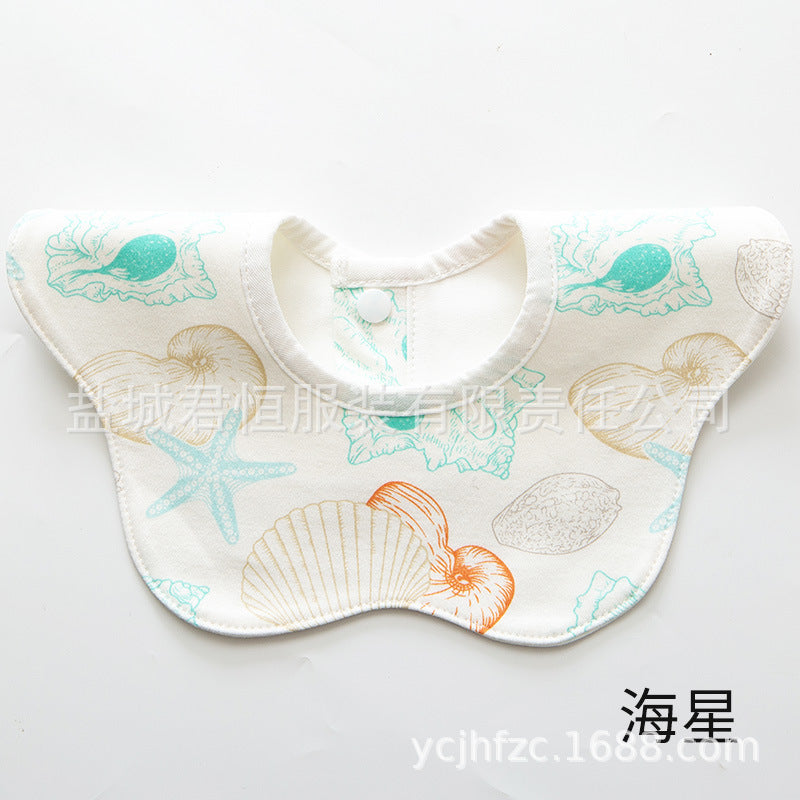 Baby bib with sea-themed design on a white background