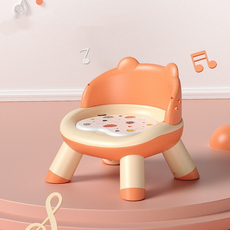 Children's chair with music notes on a pink background