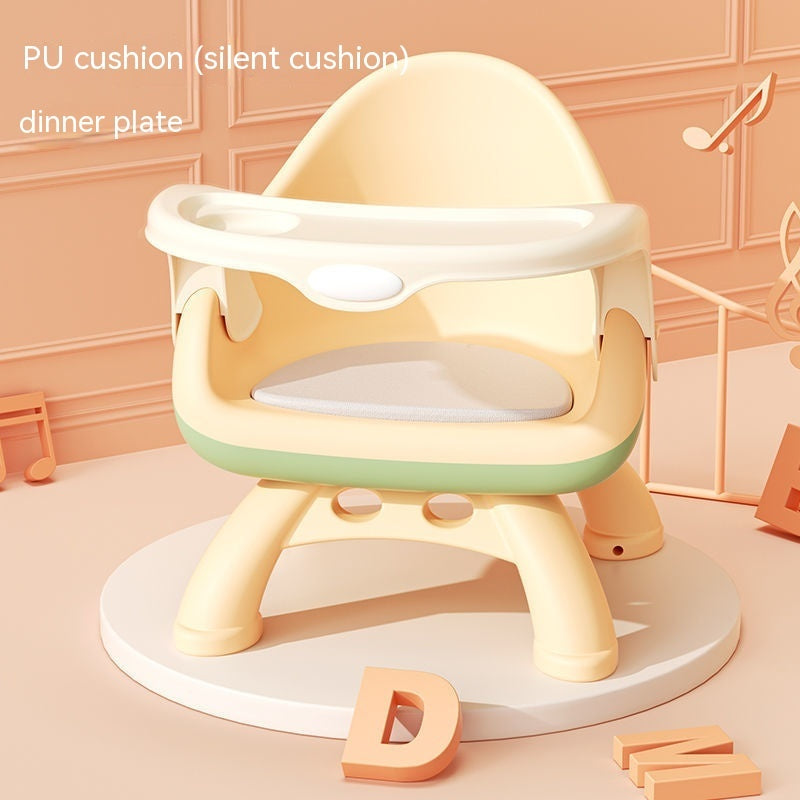 Children's training seat with PU cushion and dinner plate on a light pink background
