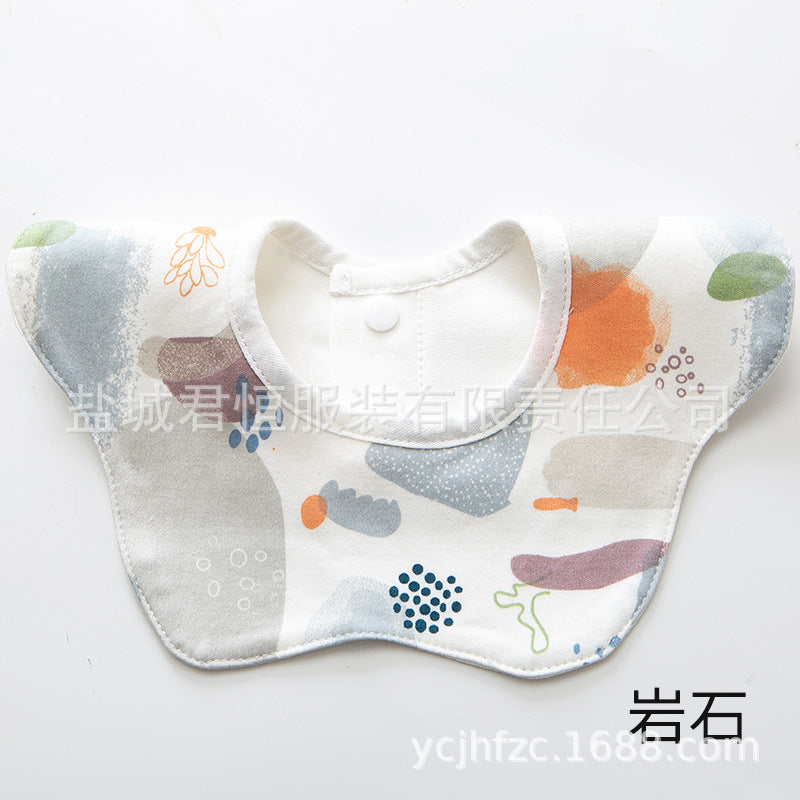 Baby bib with colorful patterns on a white background