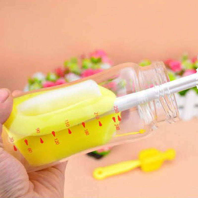 Yellow measuring cup with red markings held by a hand against a blurred floral background