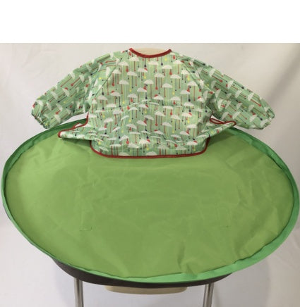 Green baby bib and tray set on a white background