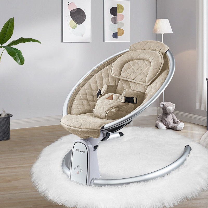 Baby swing chair in a room with a teddy bear and plant decor