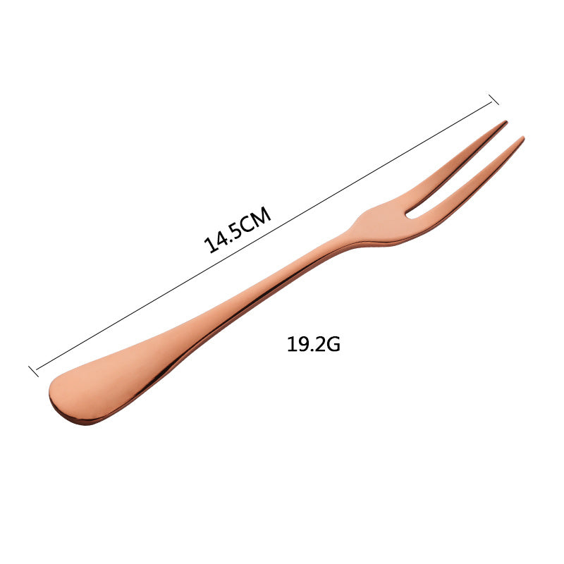 Rose gold fork with measurements on a white background