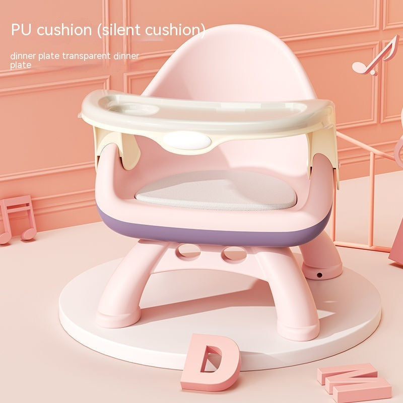 Pink and white baby seat with cushion on a pink background