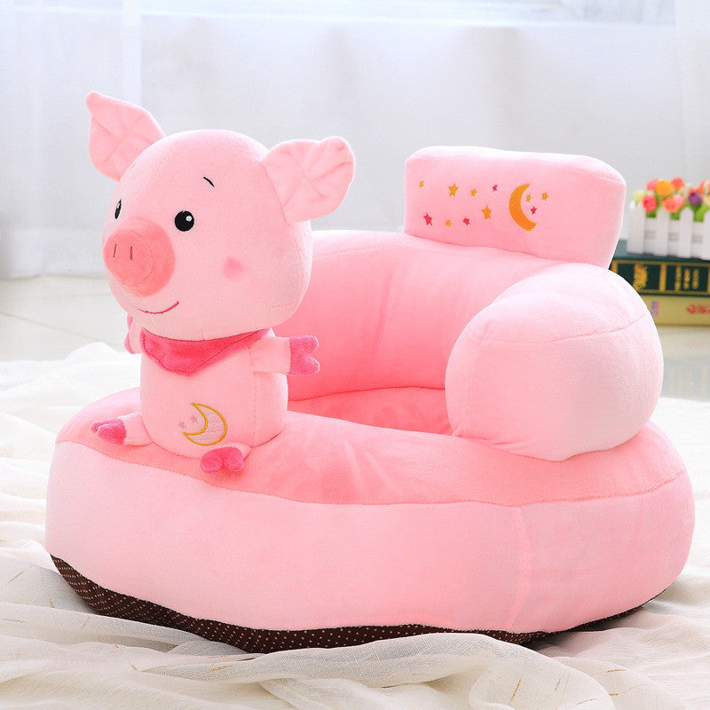 Pink pig-shaped children's chair on a white background