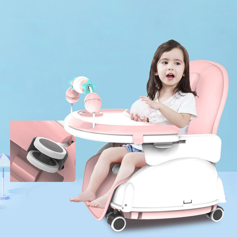 Child sitting in a pink and white high chair with a blue background