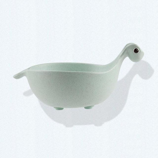 Light green ceramic bowl shaped like a turtle on a white background