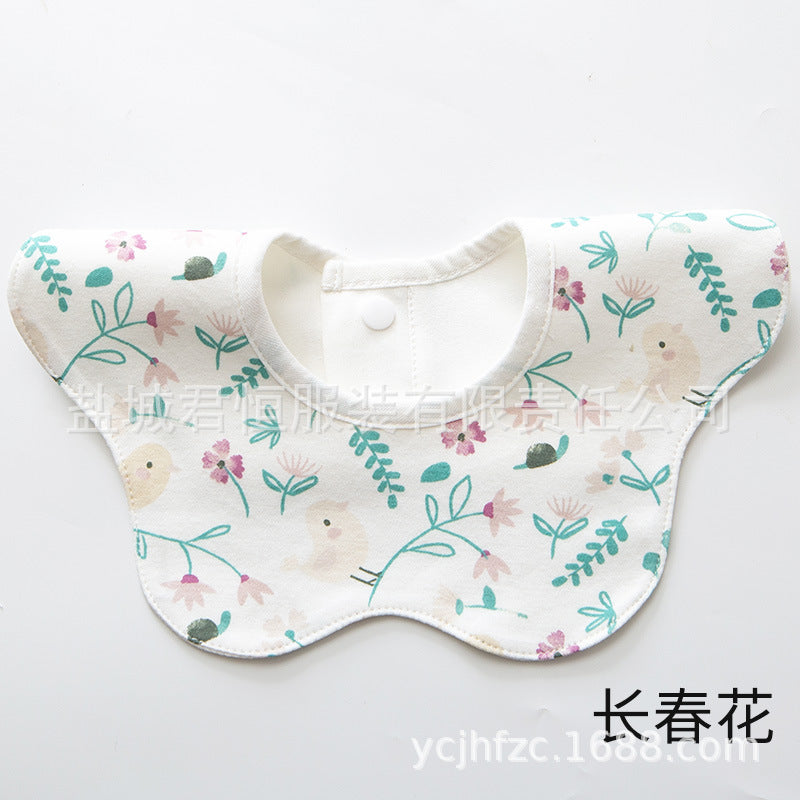 Baby bib with floral pattern on a white background