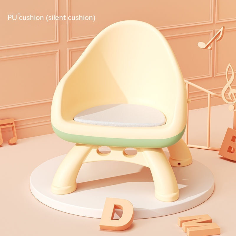 Children's chair with a soft cushion on a light pink background