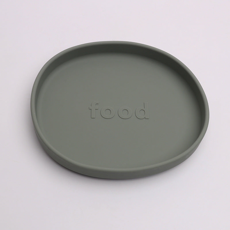 Green plate with 'food' embossed on a white background