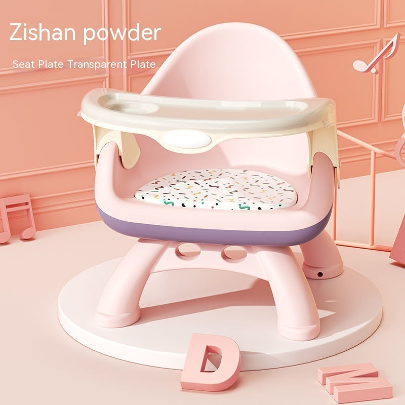 Pink and white baby seat with transparent plate on a pink background