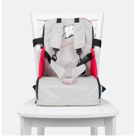 Baby high chair with a red and gray cushion on a white background