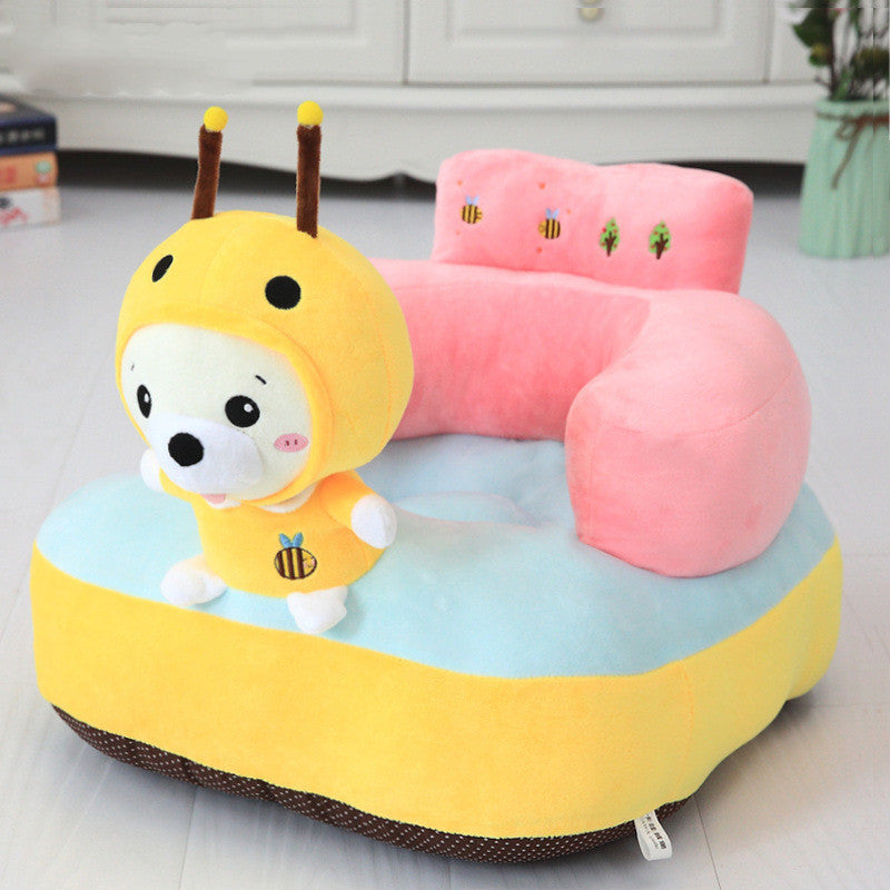 Children's plush chair with bee design on a light-colored floor.