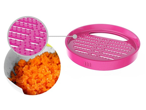Pink kitchen tool with a grid design, showing shredded carrots inside.