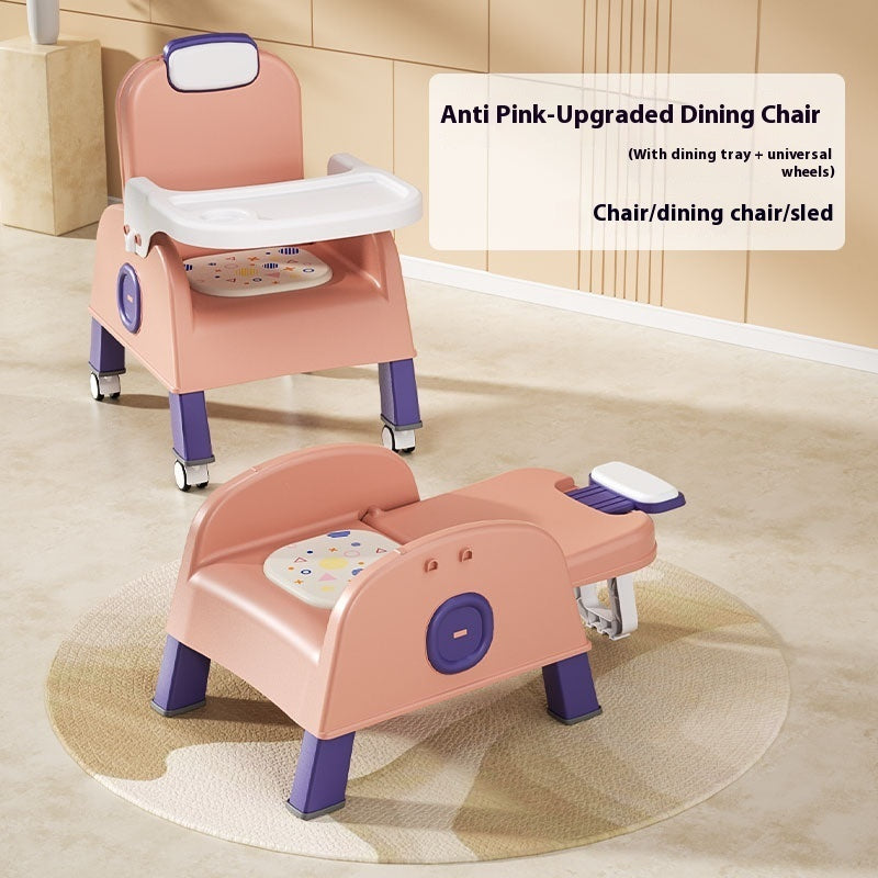 Pink and purple children's dining chair with wheels on a beige floor.