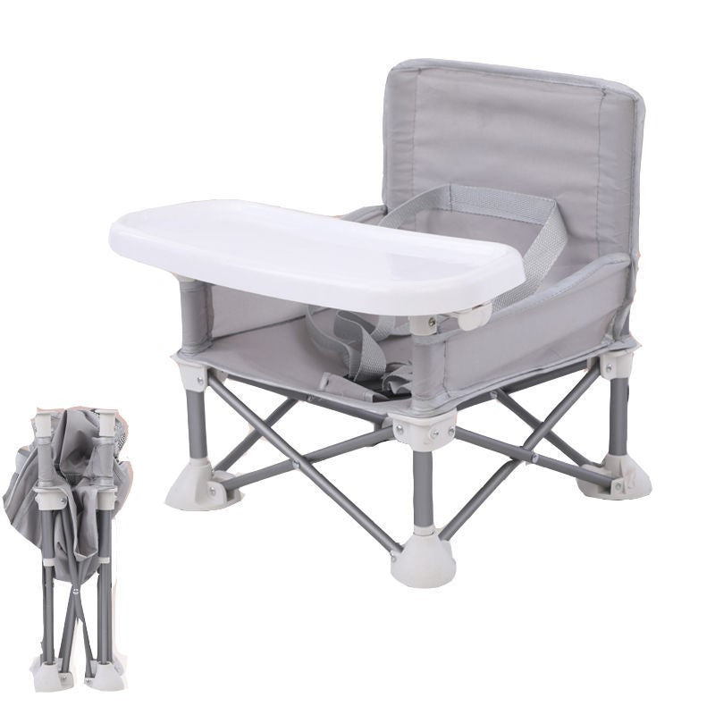 Gray and white portable baby high chair with tray on a white background