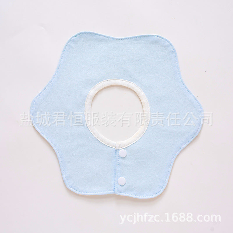 Light blue bib with white trim on a light gray background