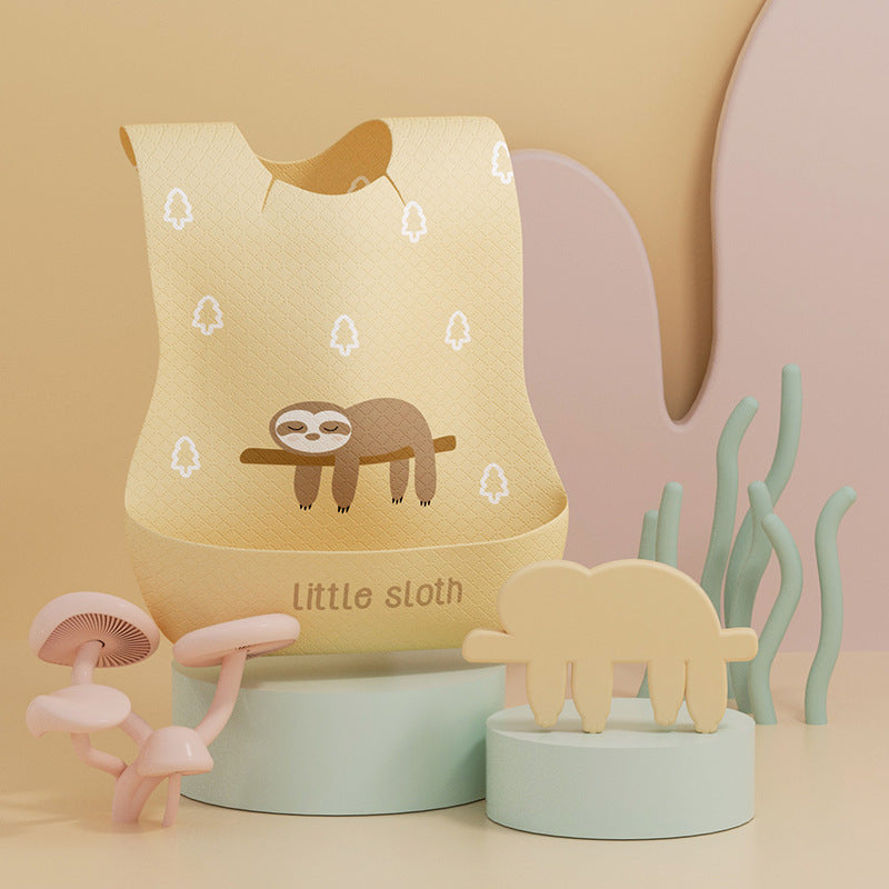 Children's night light with sloth design and small animal figurines on a pastel background