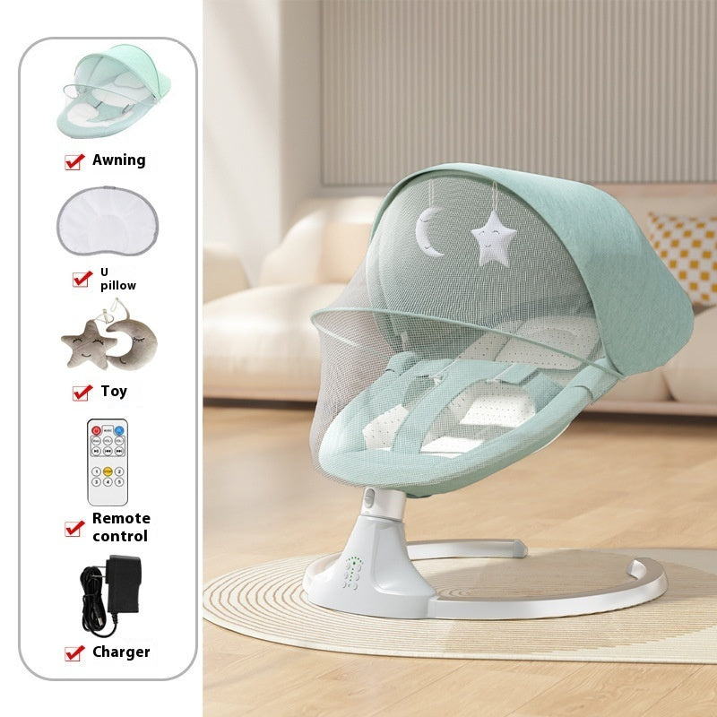 Baby swing with remote control and accessories on a wooden floor.