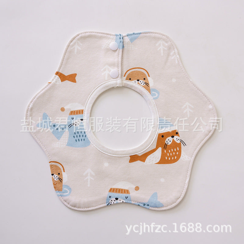 Baby bib with cartoon animal design on a light gray background