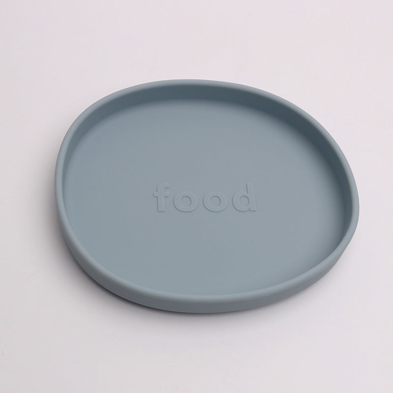 Blue plate with 'food' text on a light gray background