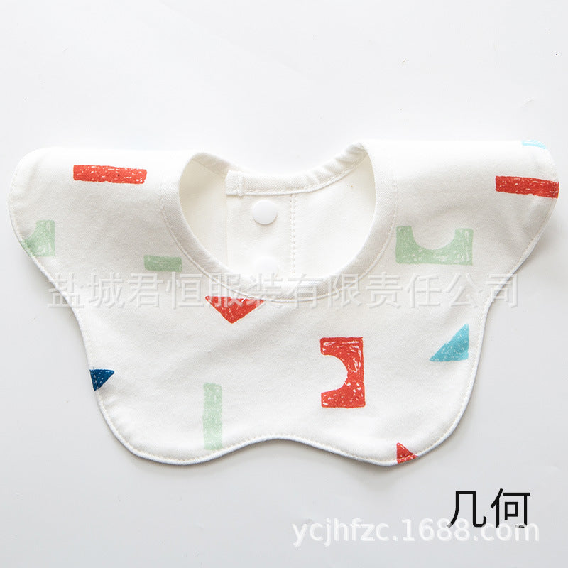 White baby bib with colorful geometric patterns on a white background