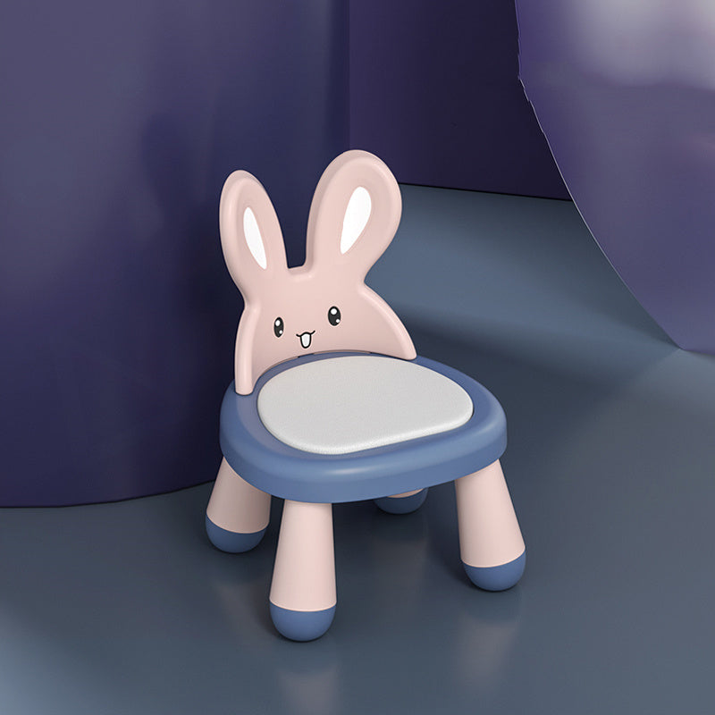 Children's chair shaped like a rabbit with a blue base and pink body on a dark background