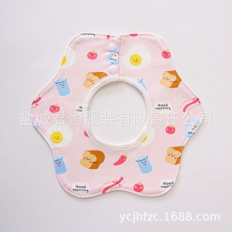 Pink baby bib with cartoon designs on a white background