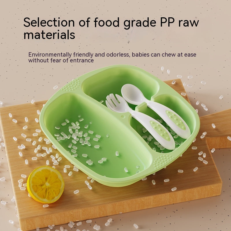 Green baby plate with white utensils on a wooden surface with text about food grade PP raw materials.