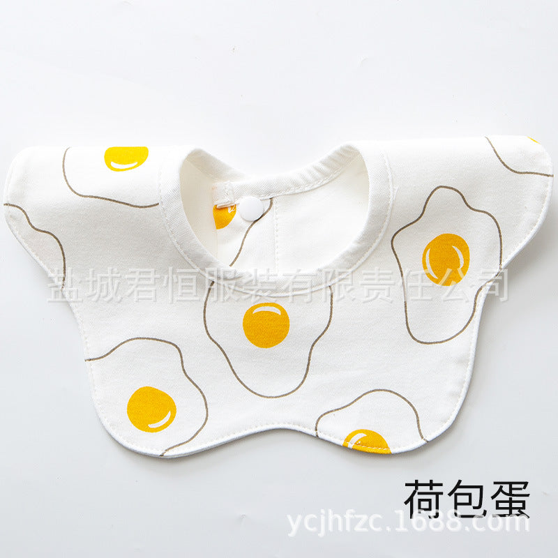Baby bib with fried egg pattern on a white background