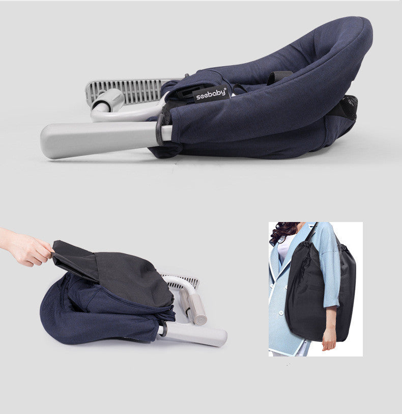 Foldable baby seat with carrying bag on a light gray background