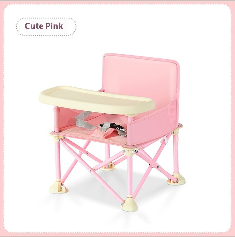 Pink baby high chair with beige tray on a white background