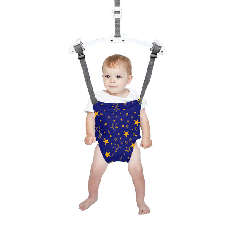 Baby in a blue star-patterned outfit with a harness on a white background