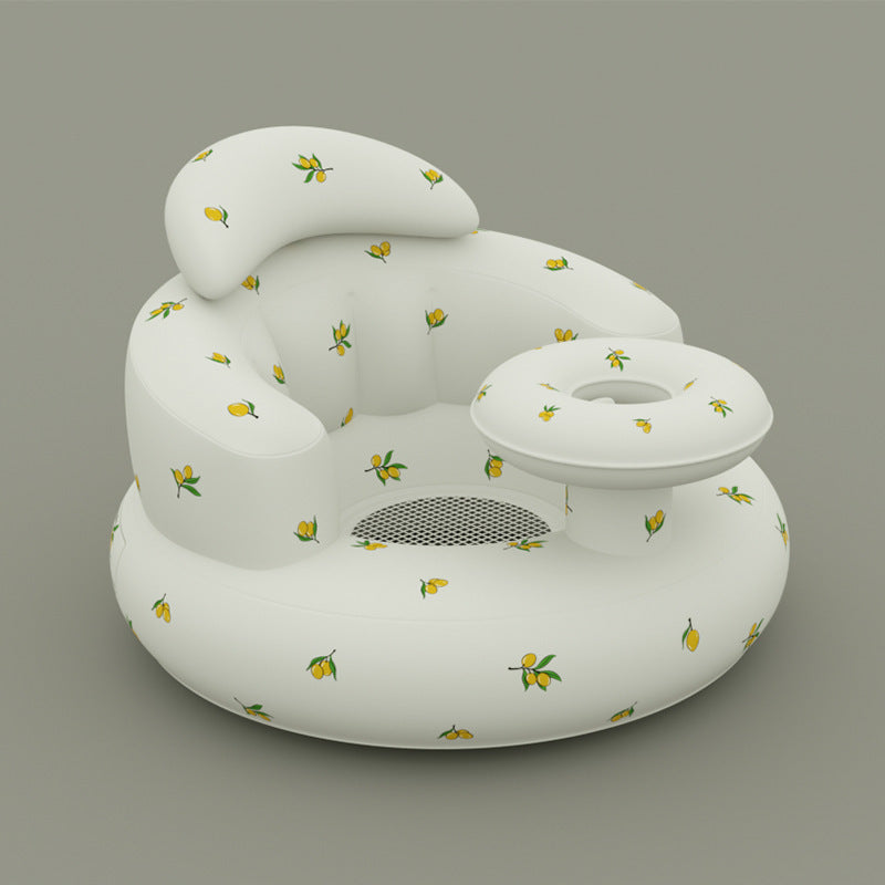 White inflatable pool float with lemon pattern on a gray background