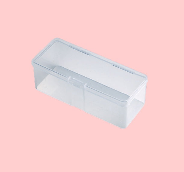 Clear plastic container with a lid on a pink background