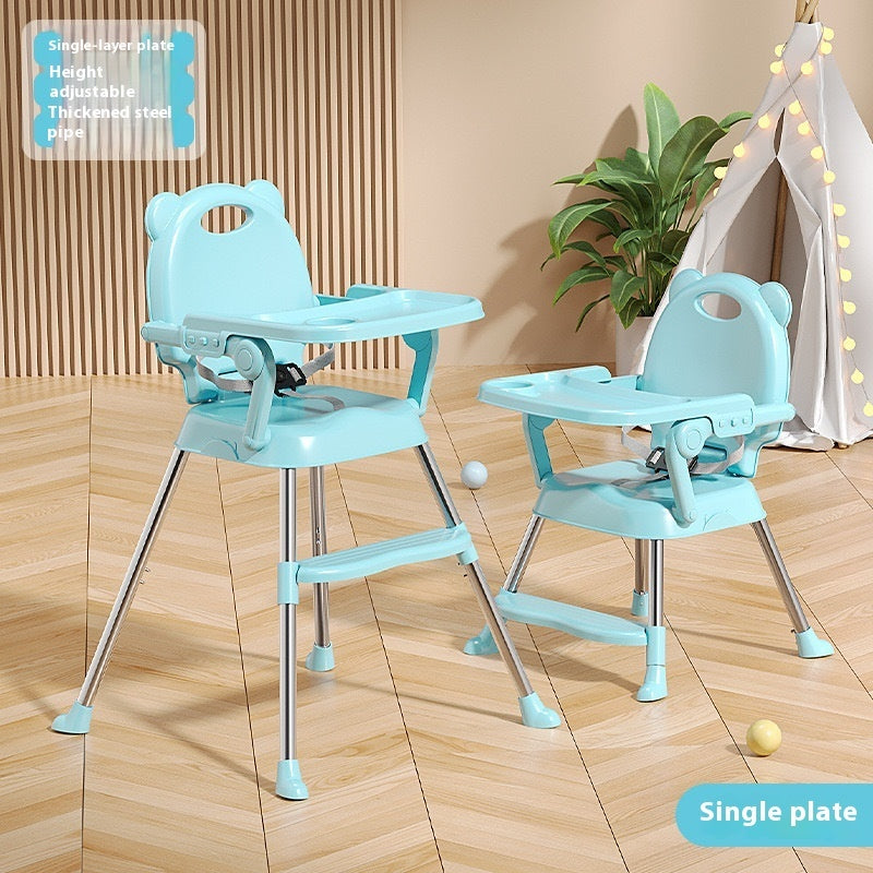 Two adjustable high chairs on a wooden floor with a plant in the background.