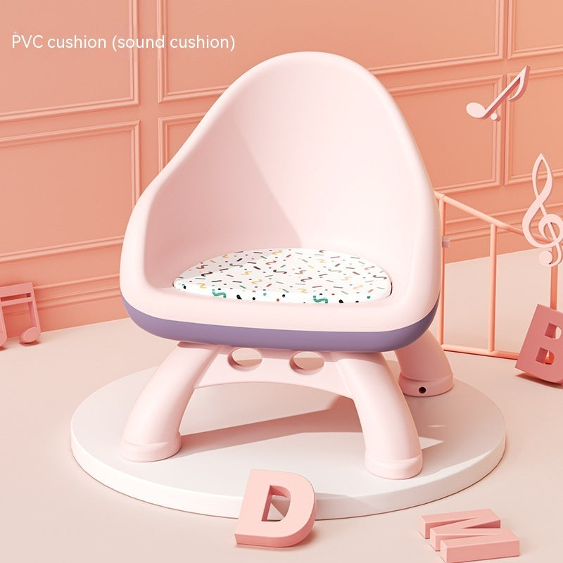 Pink baby seat with a sound cushion on a pink background