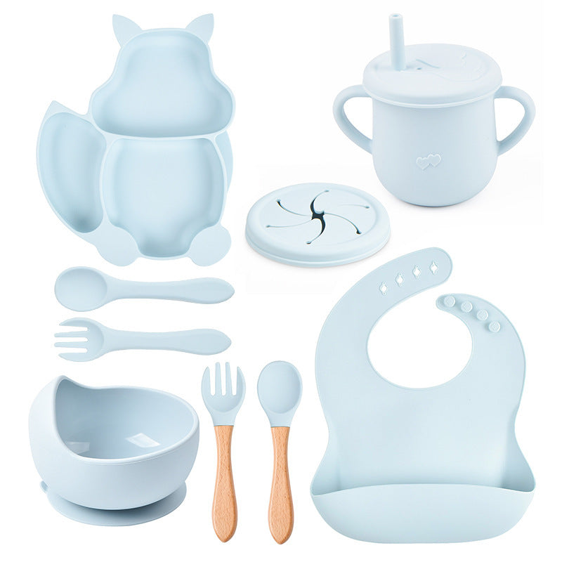 Collection of baby feeding utensils and accessories in light blue on a white background