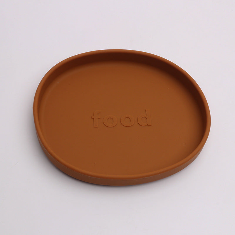 Brown ceramic plate with 'food' embossed on a white background