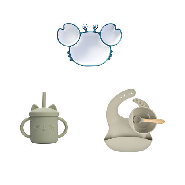 Children's sippy cup with cat design, teething ring, and mirror on a white background