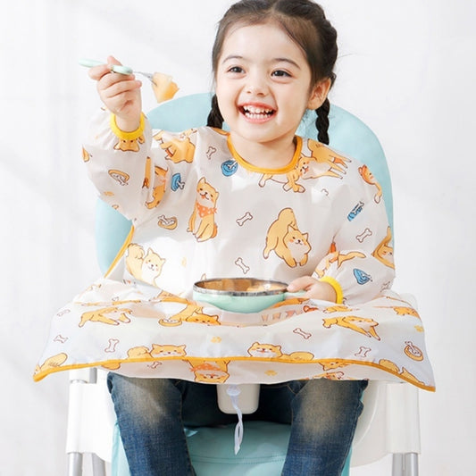 Child wearing a cartoon-patterned bib while sitting in a high chair with a bowl and spoon.