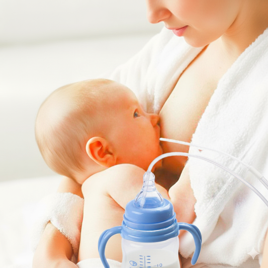 Baby being fed from a bottle with a pacifier attachment, held by a person in a white robe.