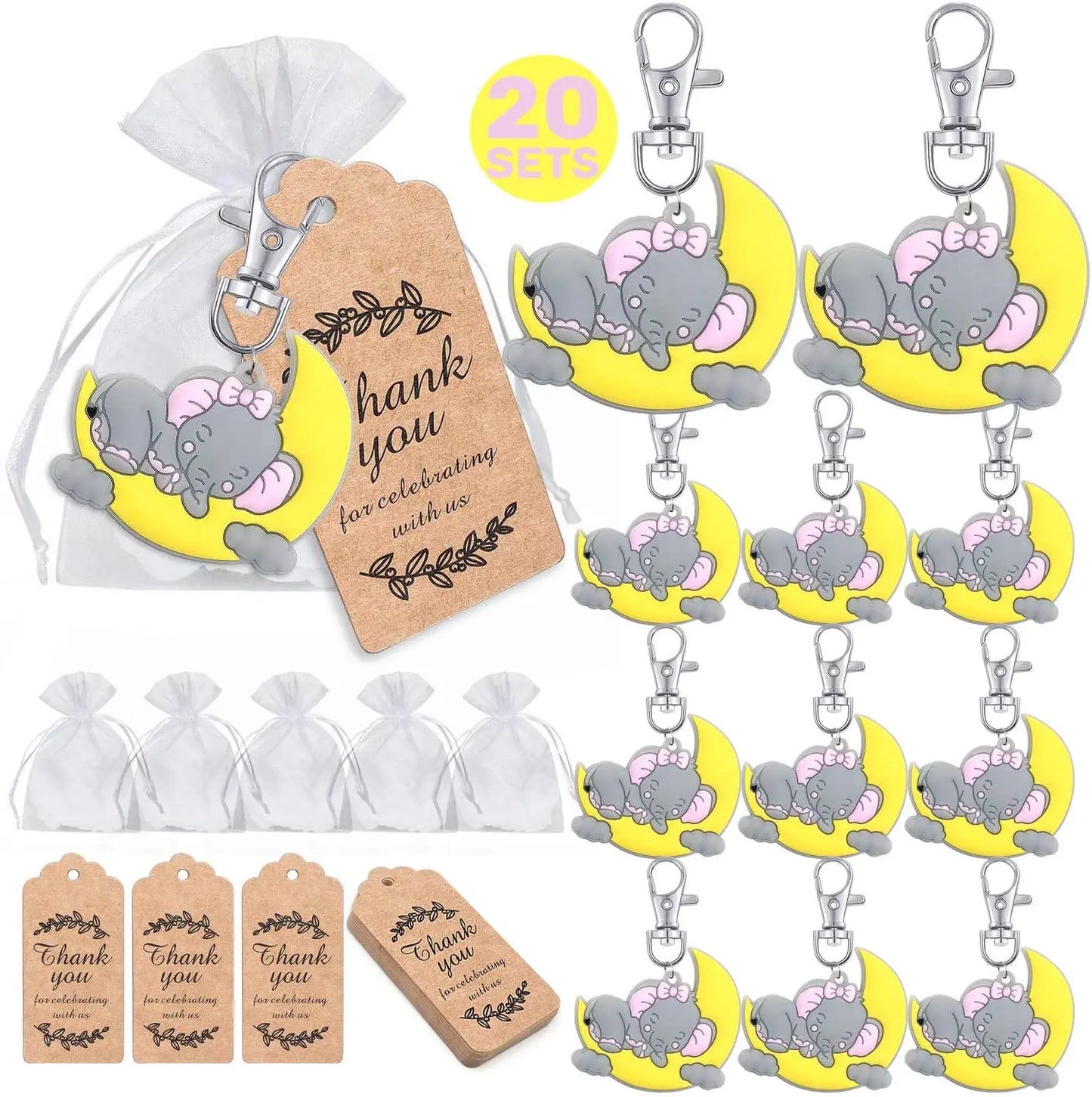 Set of keychains with elephant design, gift bags, and 'thank you' tags on a white background