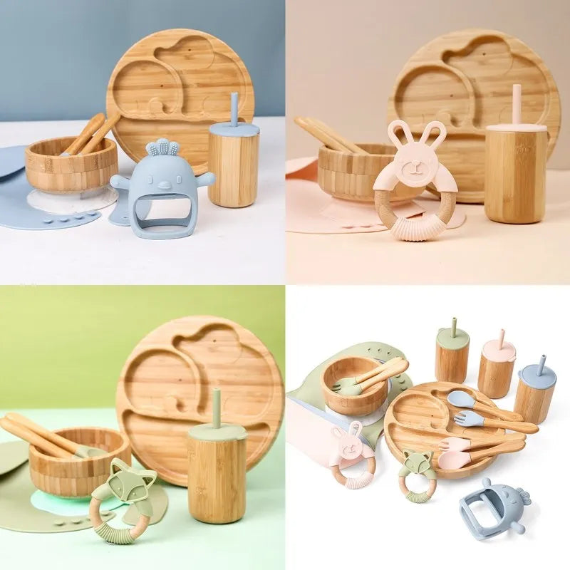 Set of bamboo baby utensils and toys on a colorful background
