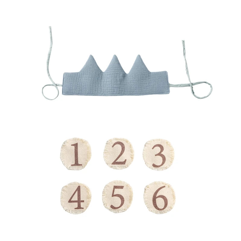 Blue crown with wooden numbers on a white background